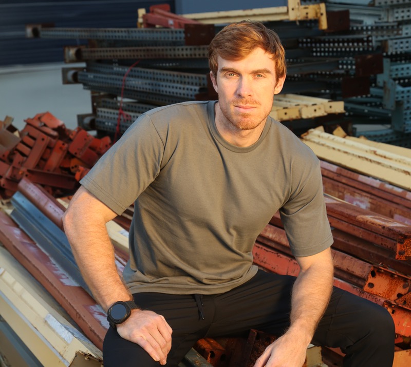 Man wearing a gray union apparel t-shirt at a job site