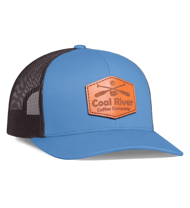 Blue and brown trucker cap with leather patch logo